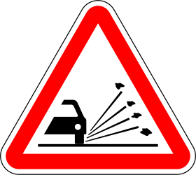 Loose chippings and stones on the road warning